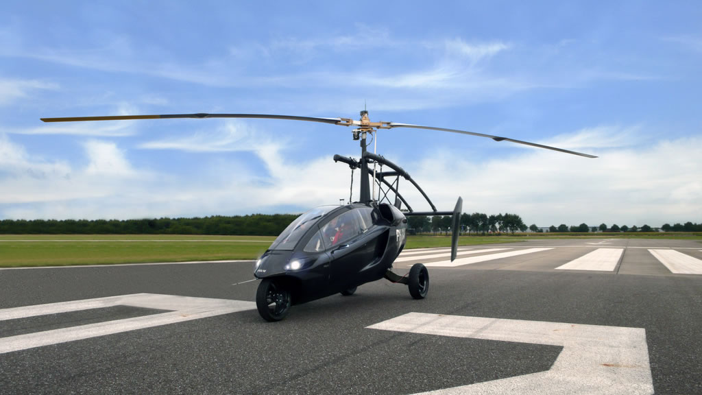 Flying car rotocopter on a runway.