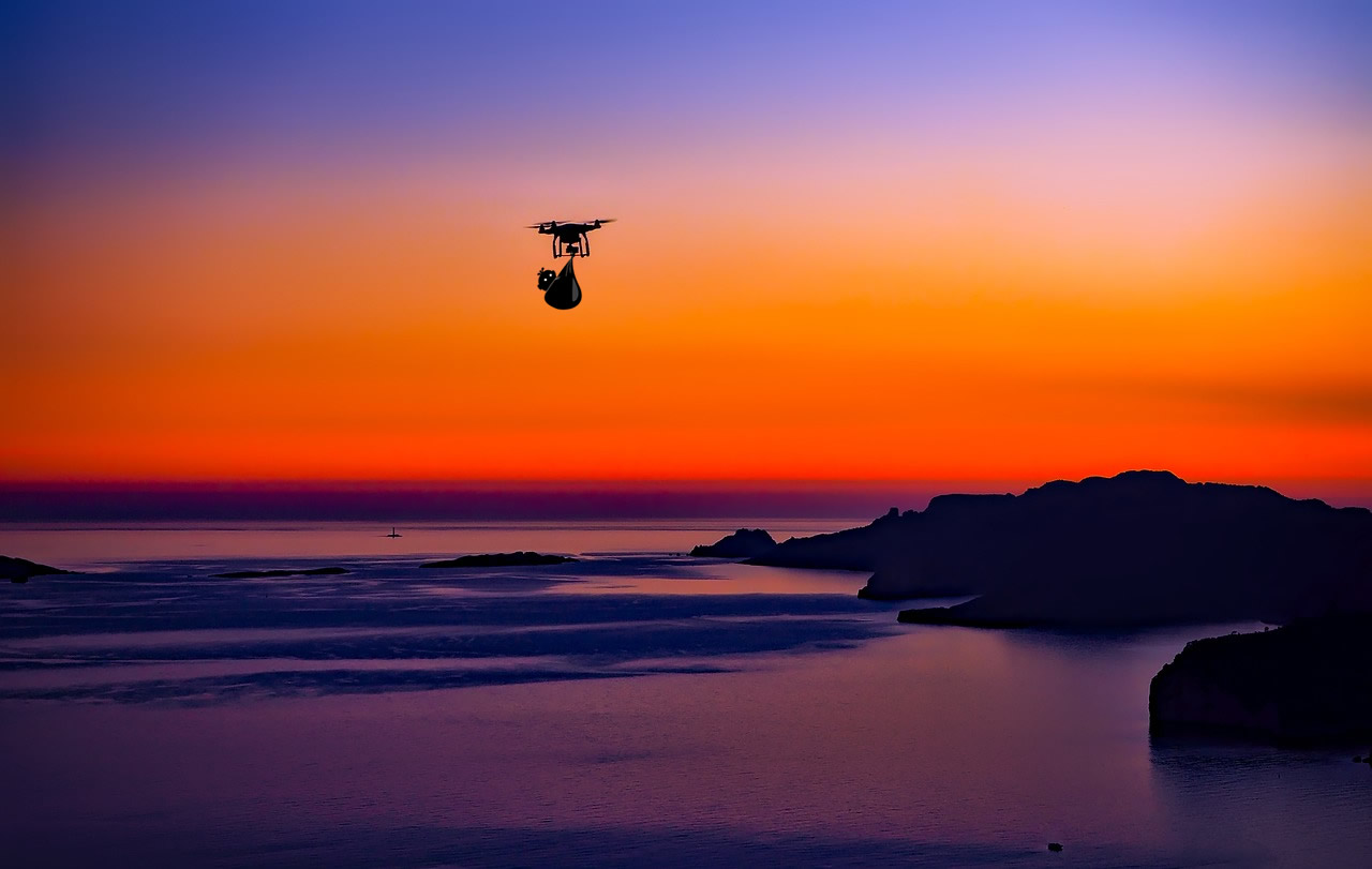 Drone during ocean sunset drawing