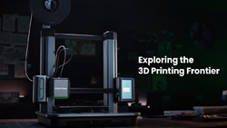 A black open-frame 3d printer sits on a desktop. Text reads Exploring the 3d Printing Frontier.