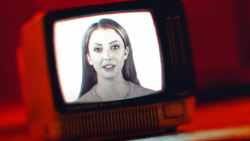 an image of a woman on a small vacuum tube tv