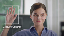 A person is holding up their open right hand. A white box is overlayed the hand and the text underneath says Gesture Control.