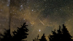 A shooting star in the night sky