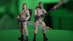 A closeup of two Ghostbuster action figures on a table