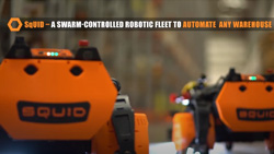 two short squat rolling robots moving towards the camera with the word SQUID written on the front
