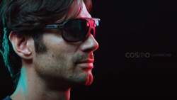 A side view of a person wearing dark sunglasses.