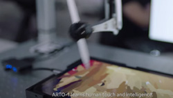 A blurred image of a robot holding a stylus creating art on a tablet