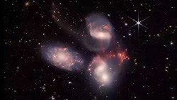 An image of a close group of 3 galaxies taken by the James Webb Space Telescope