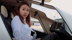 A woman who looks nervous is getting into a flying taxi.
