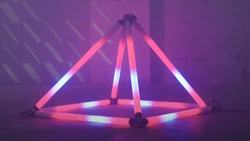 Lighted tubes form a glowing pyramid