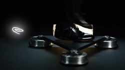 closeup of a person stepping on a single triangular tile that is attached to round cylinders at the corners