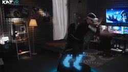 A darkened image shows a person in VR googles and holding VR controllers. They are strapped into a VR treadmill. A large screen TV is in the background showing gameplay.