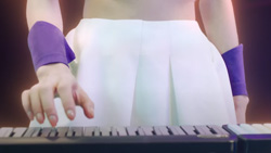 A closeup of a person playing a keyboard.