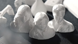 A group of small 3d busts of people on a table