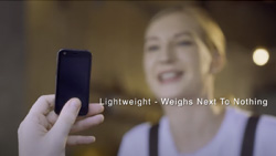 A view from a person holding a very small smartphone taking a picture of another person that is blurred. The text reads Lightweight - weighs next to nothing