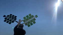 a man installing a solar power system that looks like a tree