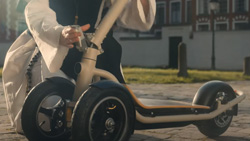 A closeup of a three wheeled wide-base escooter.