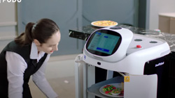 A closeup of a food server removing a dish from a delivery robot